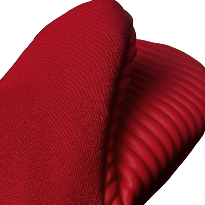 Close-up of a red textured fabric with a white background