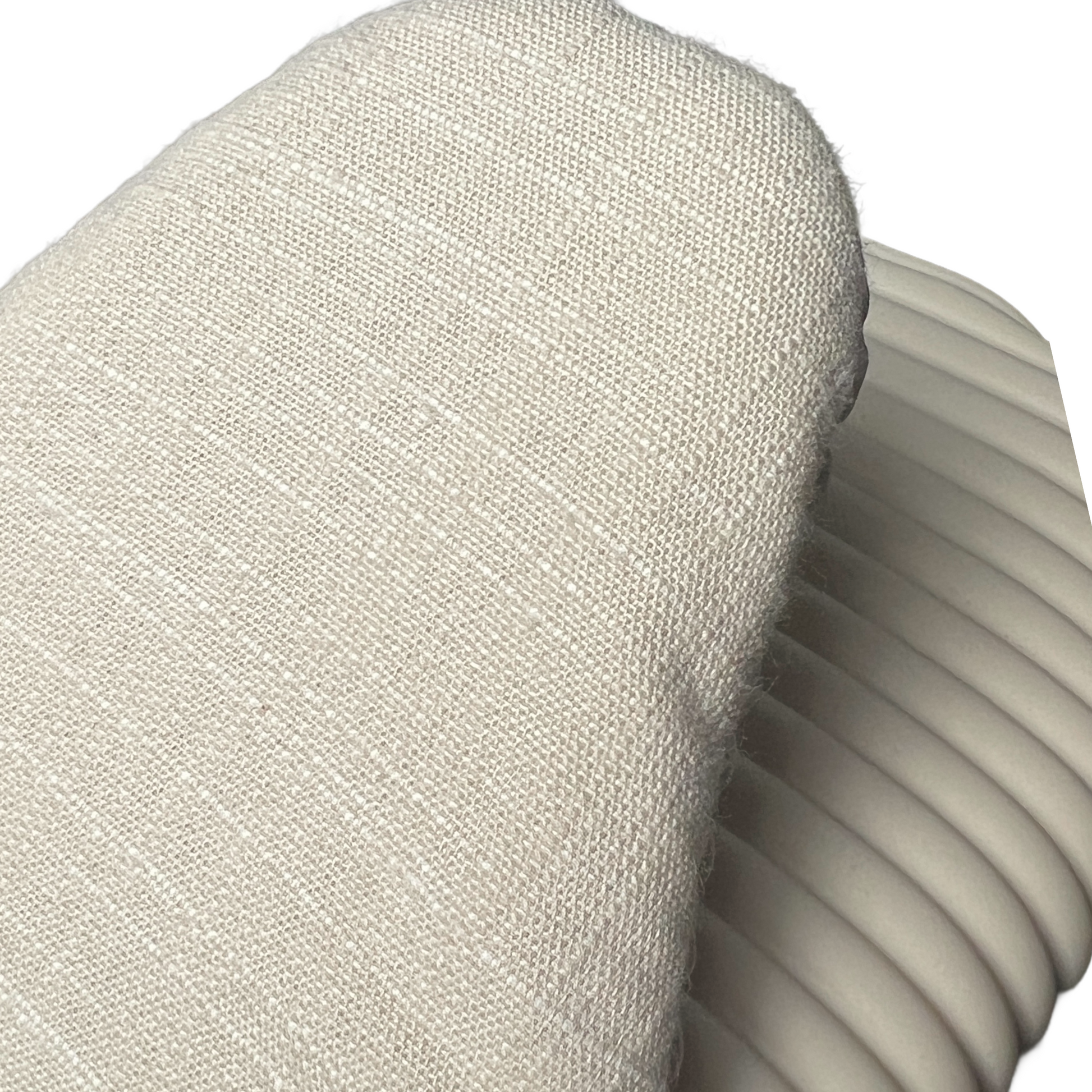 Close-up of a textured beige fabric surface with a ribbed texture.
