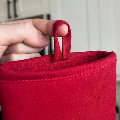 Red fabric LOOP with a hand holding onto it
